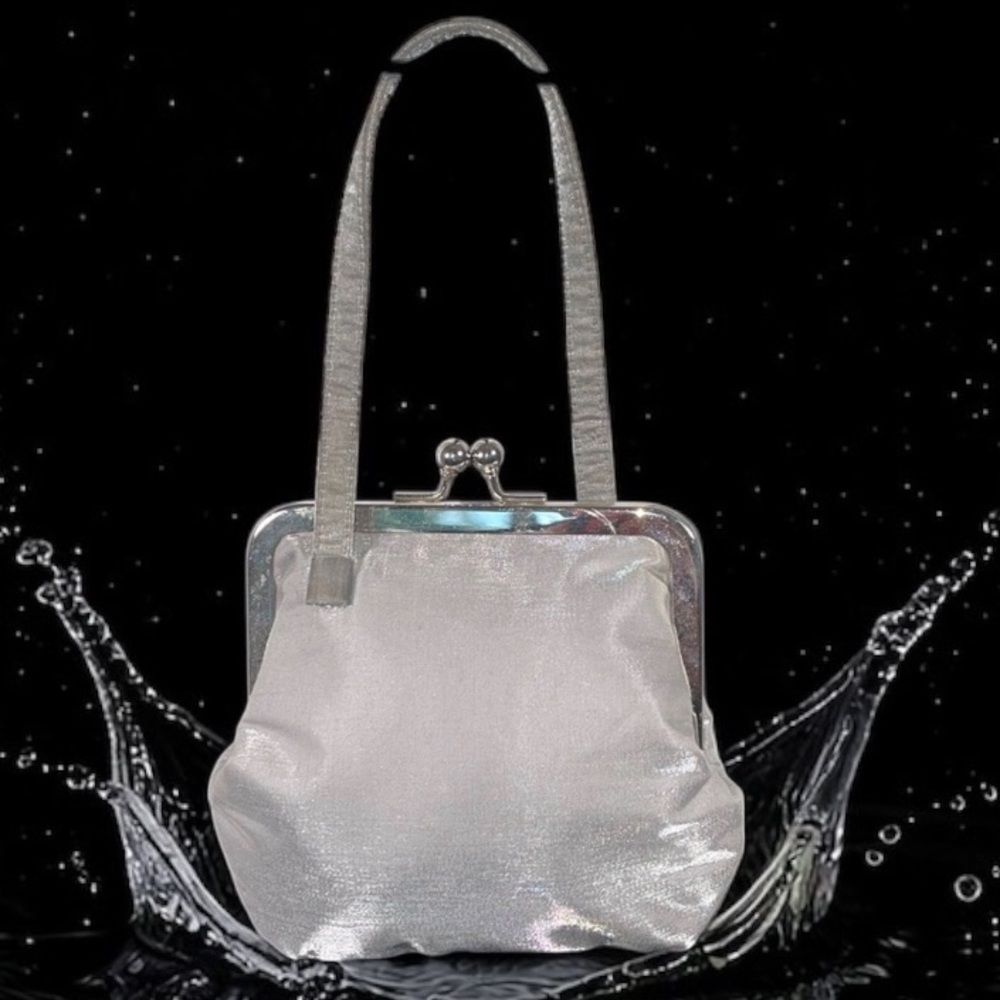 Carlo Fellini Vintage shimmering silver kiss-lock wristlet.